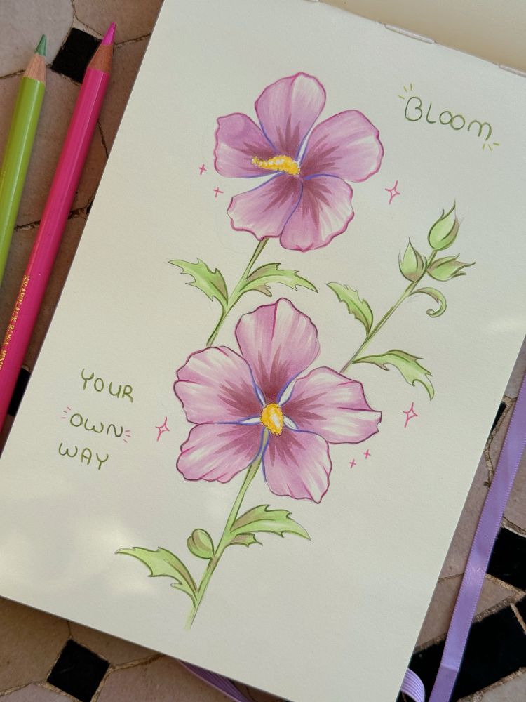 A sketchbook page with purple-pink hibiscus flowers and the text “Bloom your own way”