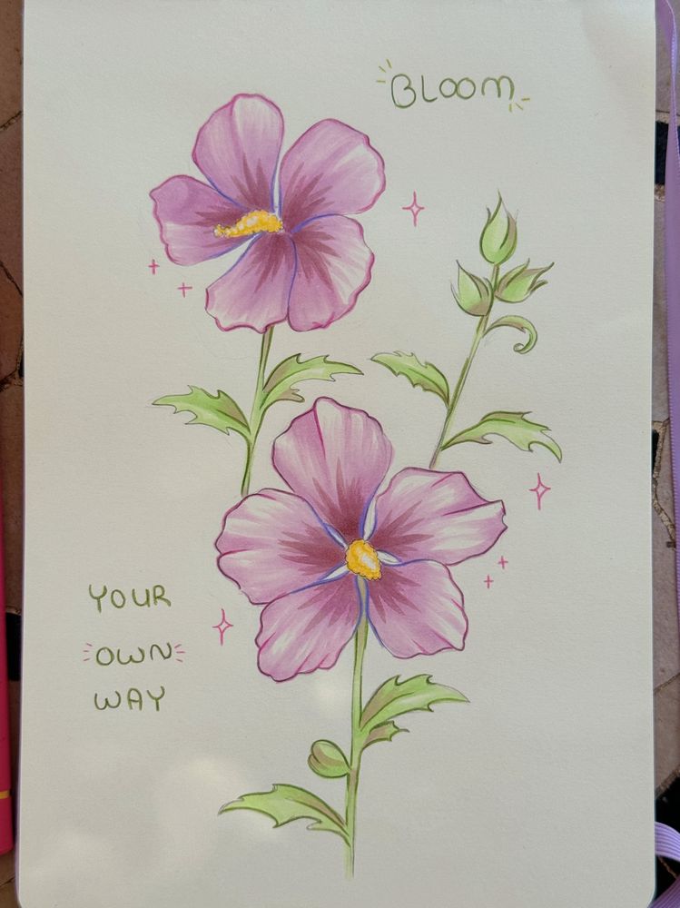 A sketchbook page with purple-pink hibiscus flowers and the text “Bloom your own way”