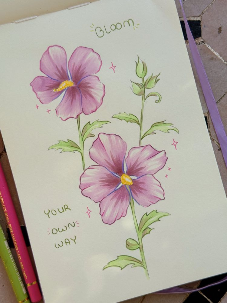 A sketchbook page with purple-pink hibiscus flowers and the text “Bloom your own way”