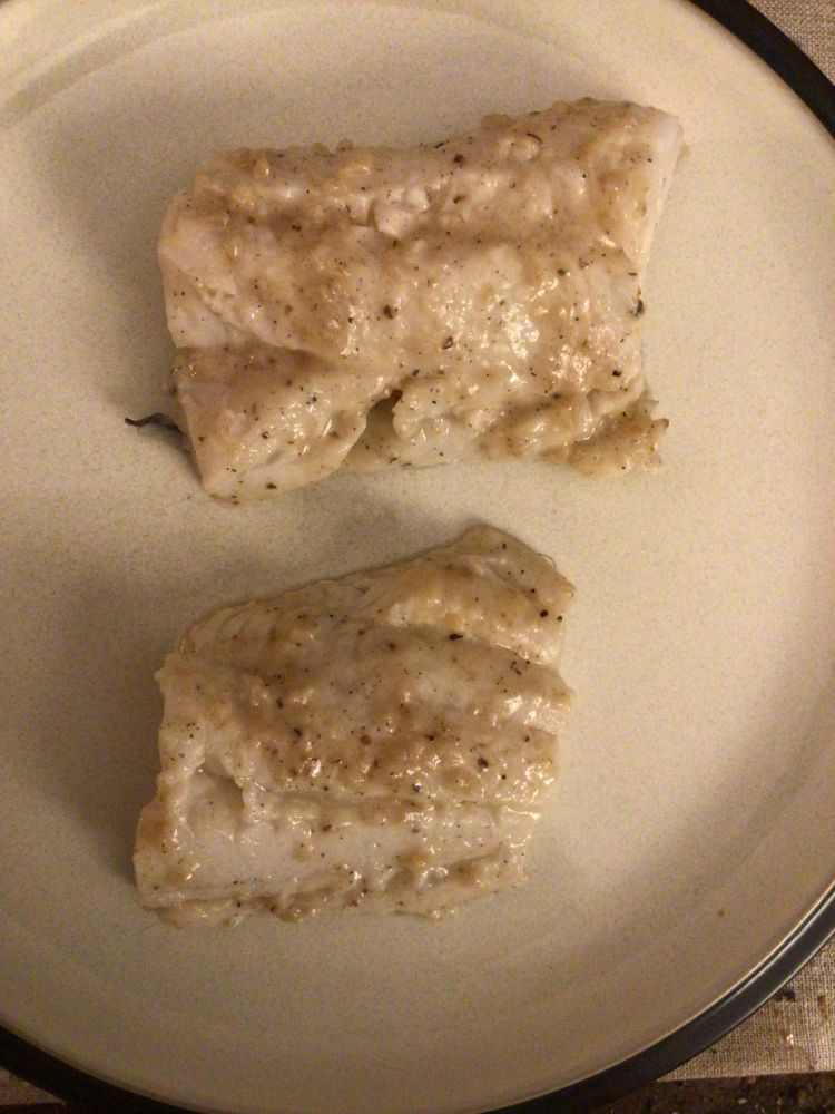 A generous portion of lemon Dijon haddock on a dinner plate