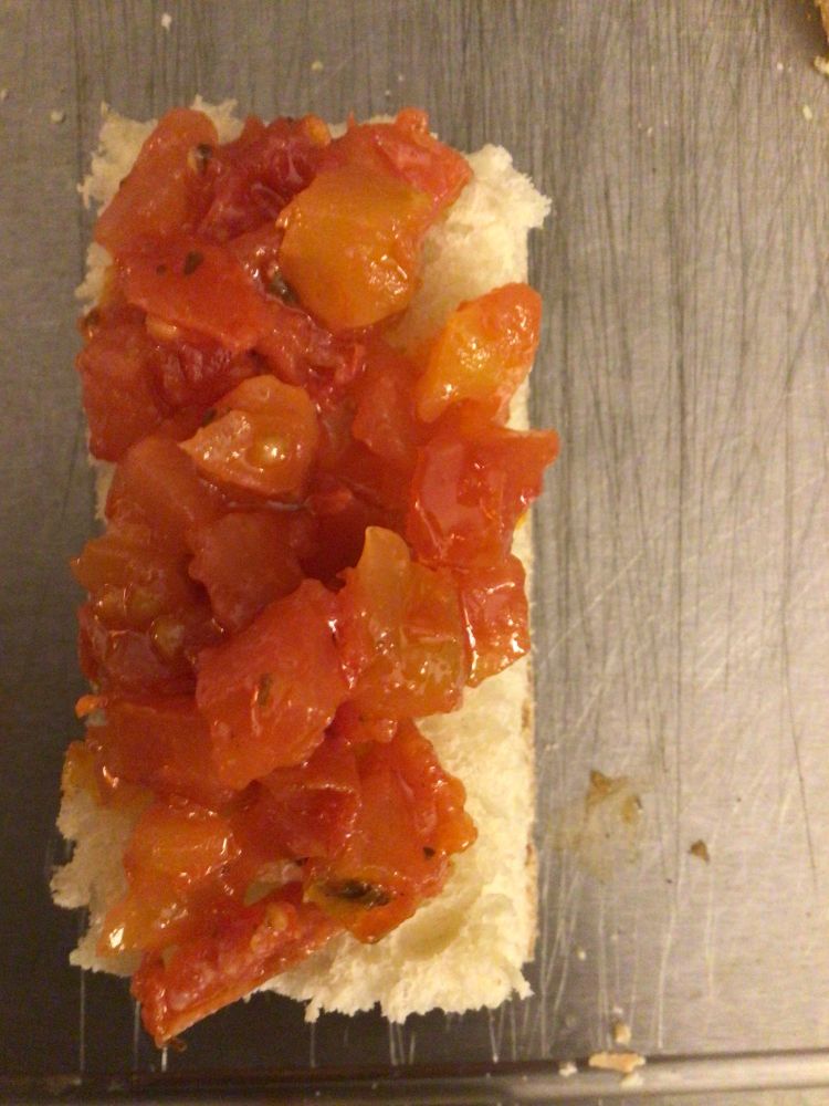 Tomato, basil, garlic and olive oil bruschetta on Italian bread