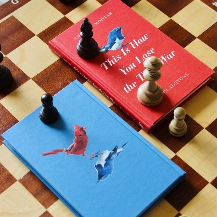 Two copies of this is how you lose the time war in the middle of a chess game. One book is red, and one book is blue.
