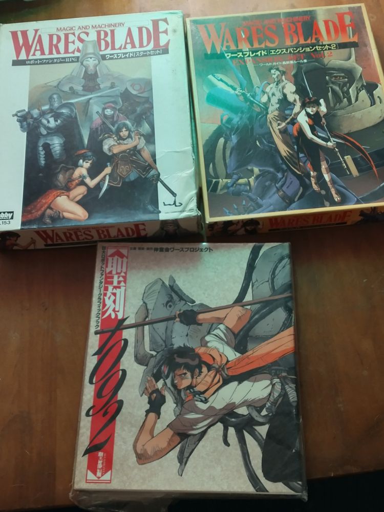 First two box sets of the Japanese fantasy mecha RPG Wares Blade as well as the Wares 1092 Artbook