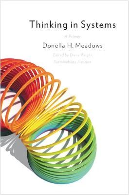 White book cover with a multi colored slinky arched across the bottom left side with text that reads 

Thinking in Systems

A primer

Donella H. Meadows

