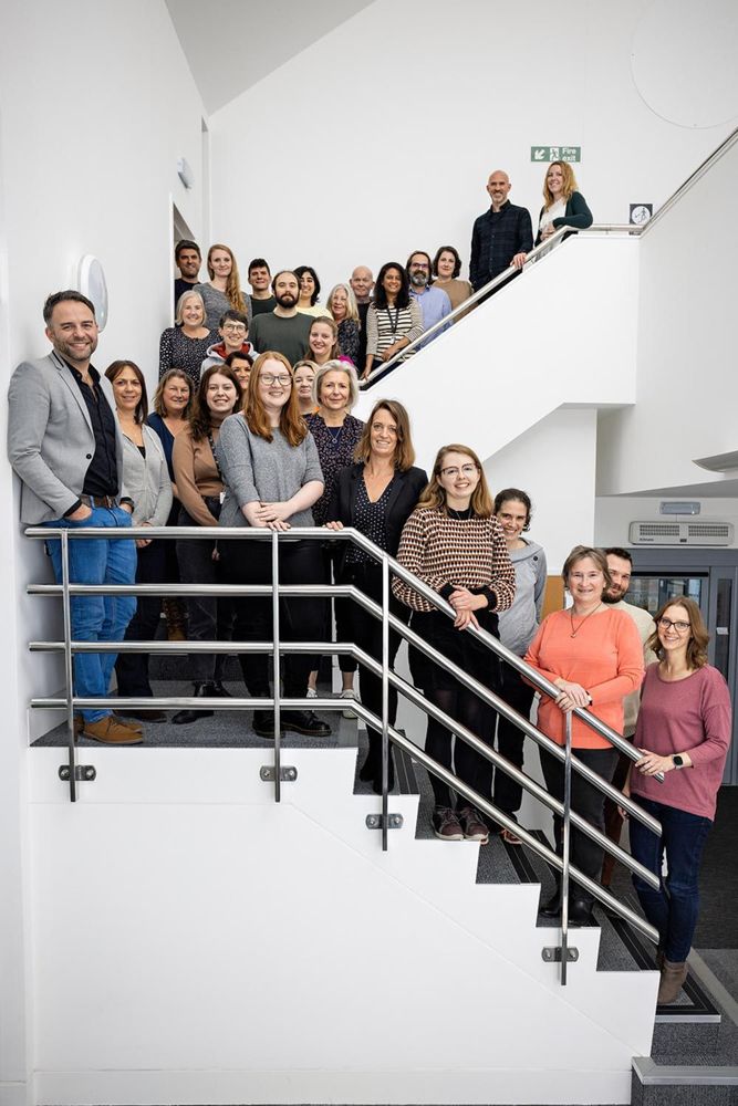A picture of the staff at The Company of Biologists in a staircase.