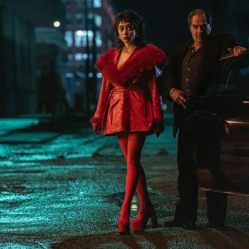 sofia gigante from the penguin series. she is in all red. a red coat. red tights, and red gogo boots. i love her