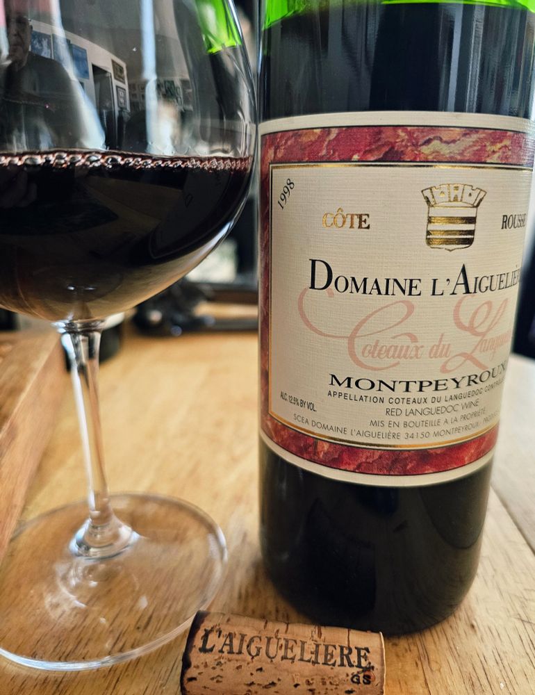 1998 Domaine L'Aigueliere from Languedoc, Montpeyroux, a French Syrah, with cork, glass and bottle. The winery's specialty bottling, Cote Rousse