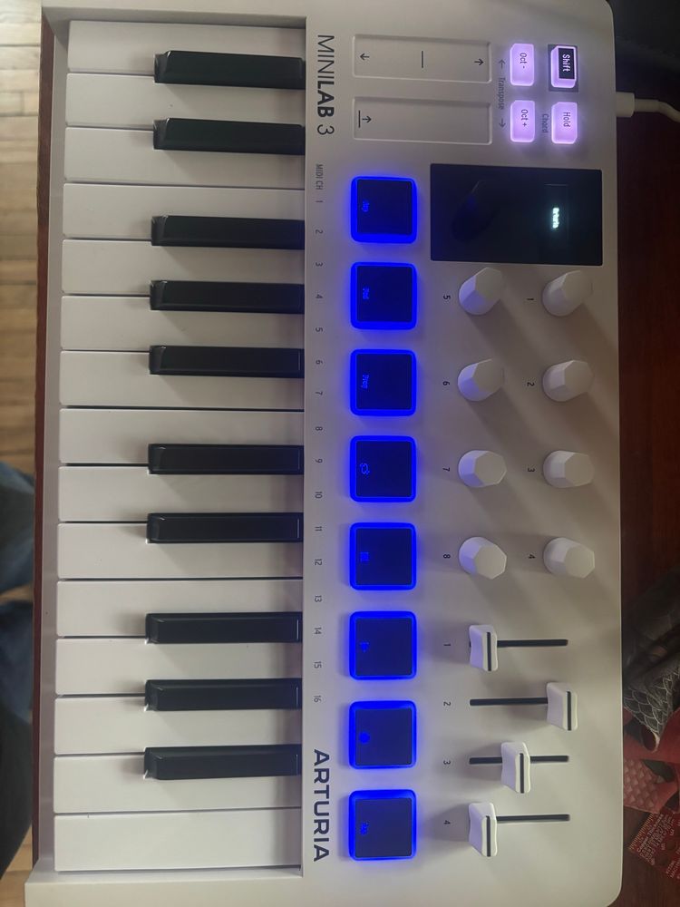 Arturia Minilab 3 midi controller - small but with 2 octaves of keys and a bunch of drum pads and faders