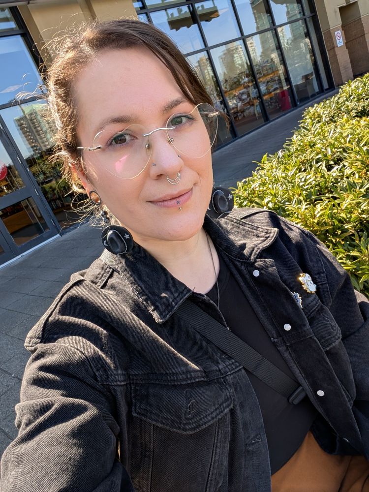 Rose's face with her hair pulled back on a sunny day