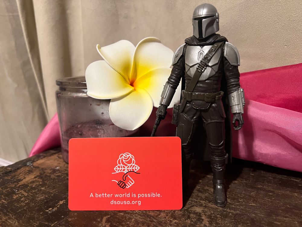 Mandalorian action figure with red card.