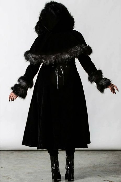 a heavy duty long line caplet coat lined with faux fur by killstar that is sadly, no longer available. the back of the coat has simple satin lacing to cinch the waist if needed. 