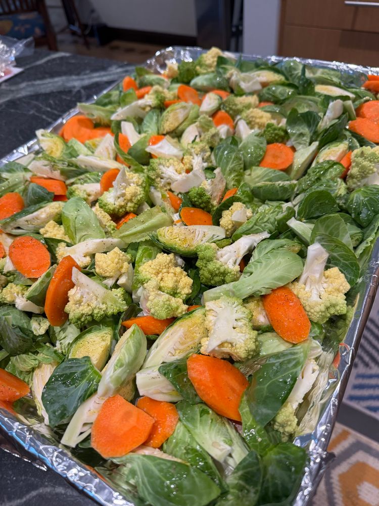 Large sheet pan of unroasted Brussels sprouts, carrots, & romanesco broccoli