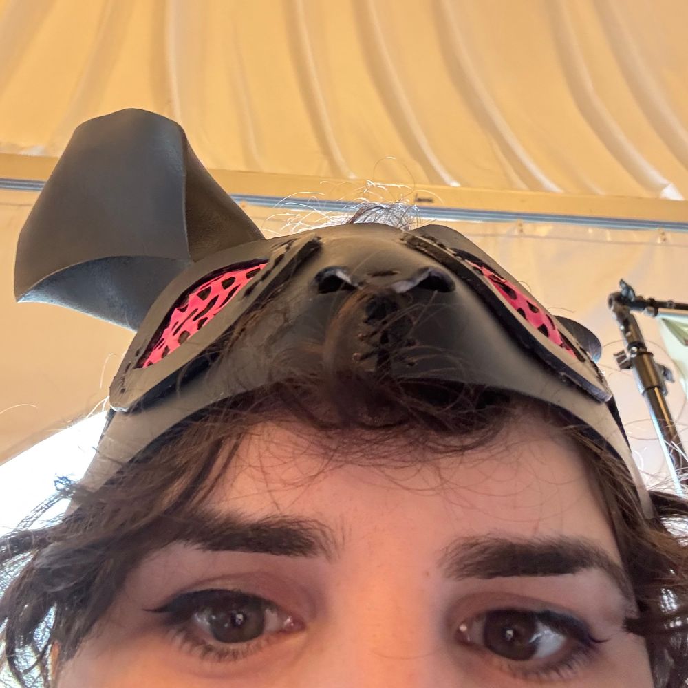 A close up selfie showing my eyes. On my head is a bunny mask matching Bass's mask, but in black.