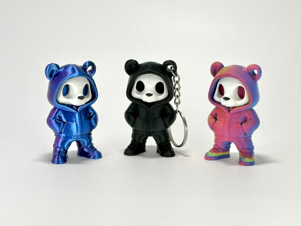 Three multi coloured panda keychains with an urban street wear theme