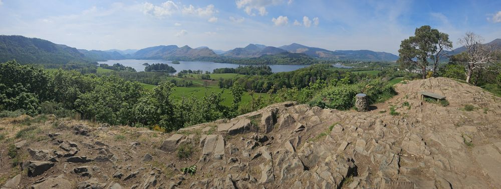 the view of several mountains & fells on the far side over Derwent Water from castlehead wood summit only 162m up & on a nicely warm early summer day midweek it was deserted & I had the view all to myself - two benches to sit & take it all in & I would certainly recommend it if you're in the area.

The walk up through the wood was nice & cool - dappled sunlight through the green canopy of the leafy trees made a change from the, rarely witnessed, hot orange ball that filled an expansive, lightly clouded, mostly blue sky.

From left to right - Castlerigg Fell, Grange Fell at the head of Derwent Water, High Spy, Maiden Moor, High Crags, Cat Bells, Brandelhow, with Causey Pike, Barrow & possibly far back Grisedale Pike onto Broom Fell - if I'm reading my OS Map correctly.