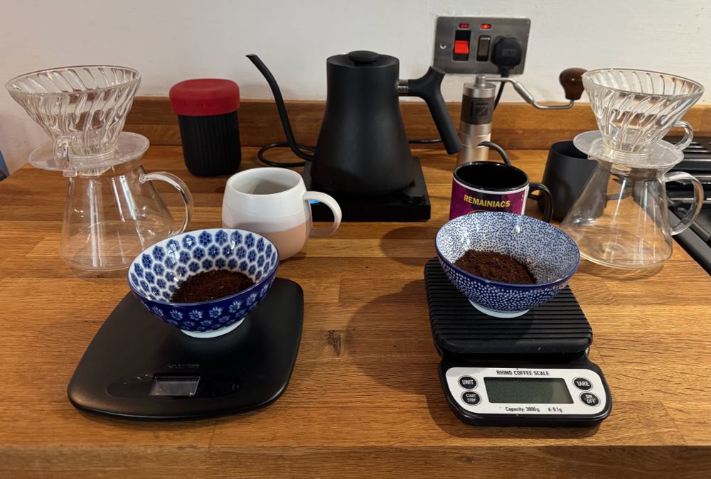 Two bowls of ground coffee sit on scales next to two v60 brewers with a Stagg EKG kettle behind them in preparation for SCIENCE!