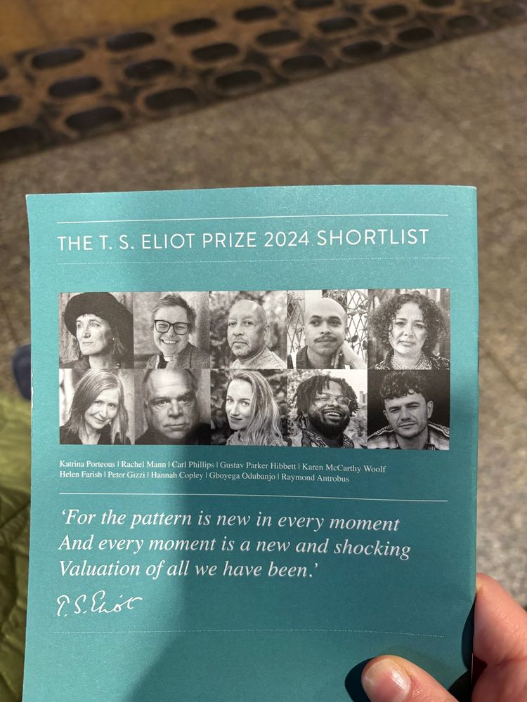 Against the background of a concrete platform, a hand holds the programme for the T. S. Eliot Prize 2024 showing the photos of the 10 shortlisted poets. At the bottom is the Eliot quote "For the pattern is new in every moment/ And every moment is a new and shocking/ Valuation of all we have been"
