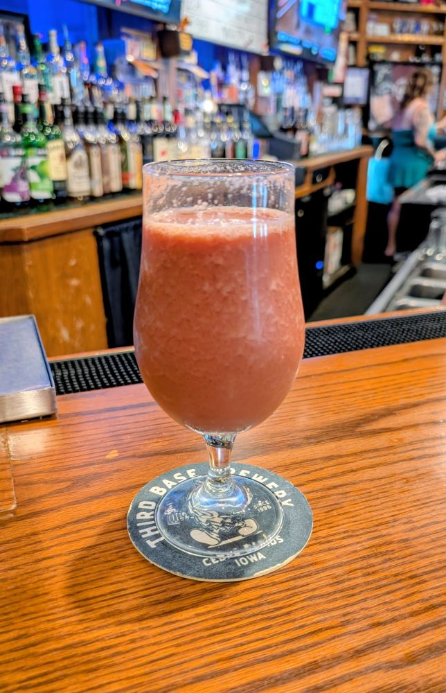Kraft Salute, a fruit smoothie sour ale with cherries, in a tulip glass.