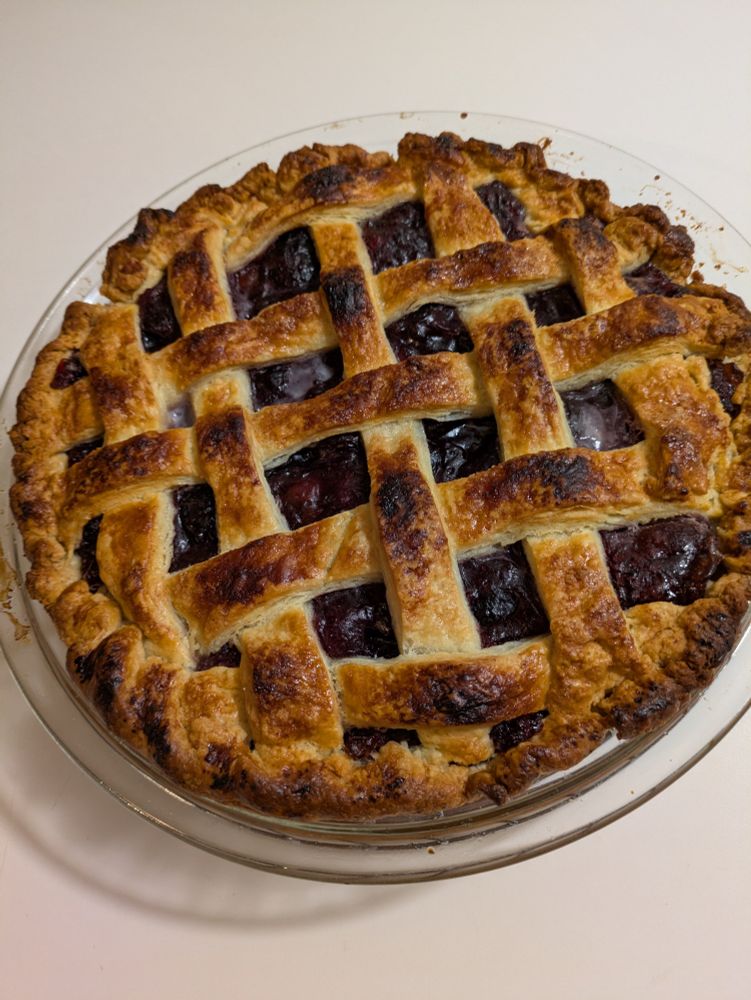 A slightly burned lattice-topped cherry pie