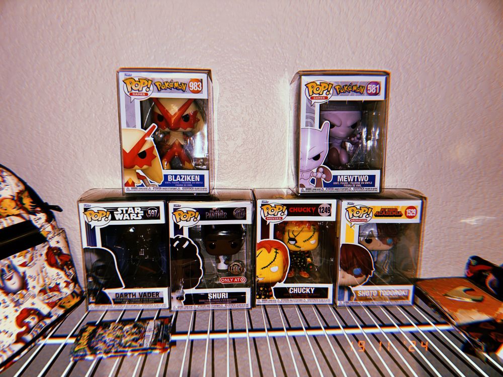 my pop vinyl collection (in order of purchase): darth vader (597), shuri (1112), chucky (1249 (the yellow one)), shoto todoroki (1529), blaziken (983), (not pictured but I have it she just doesn’t have a protective case yet rip) patchwork harley quinn (510), and mewtwo (581)