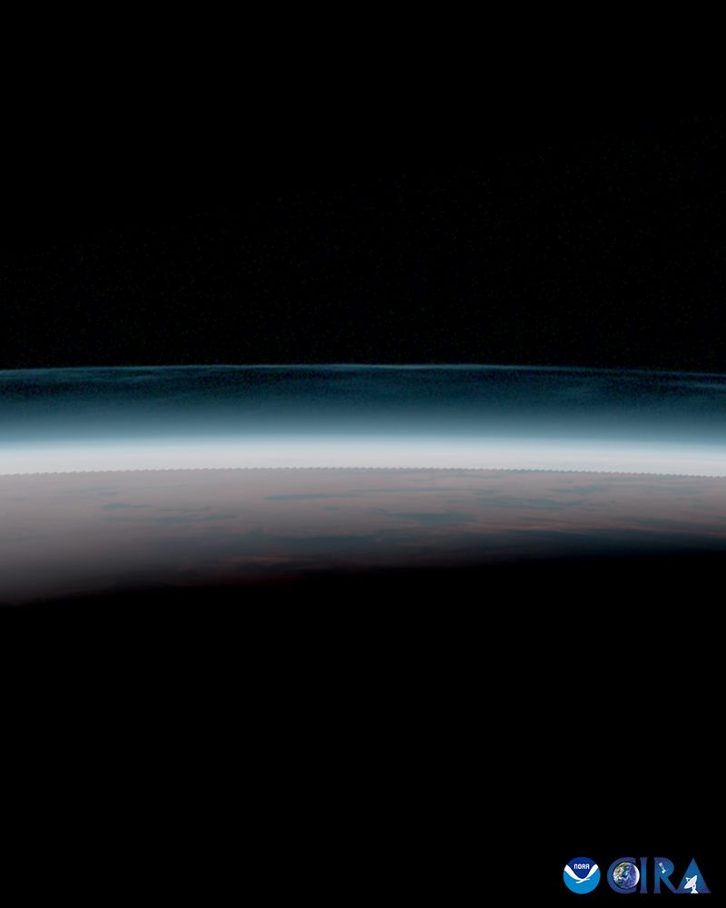 Satellite imagery of noctilucent clouds along Earth's horizon. This image contains the atmosphere rgb product from the Himawari-9 weather satellite, captured at 20:50 UTC on 2025-07-23. 