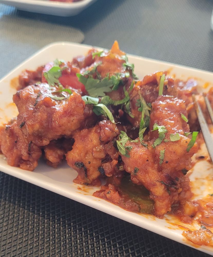 Cw food

Chilli chicken on a white plate. 