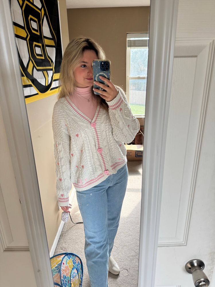 Me wearing the Taylor swift lover cardigan and light jeans with white boots