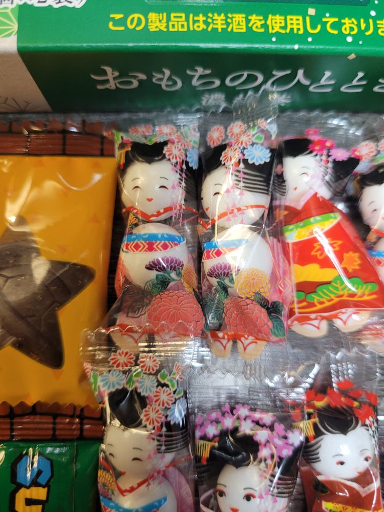 White candy balls in packaging that makes them look like Japanese Geisha