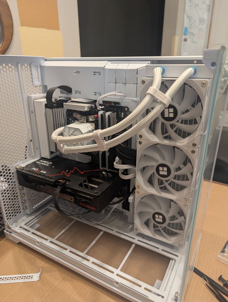 A second photo of the PC case. Wider shit that shows the 3 large cooling fans. The sides and top of the case are still bare. Not quite complete.