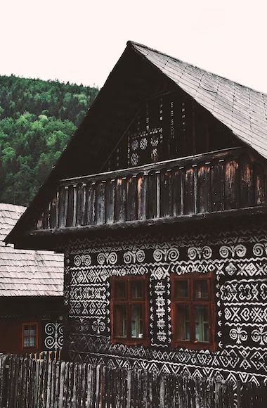 Royalty free image from Unsplash, credit in main body of the post. The image shows a traditional cottage, swiss, we think? It appears quite rundown.