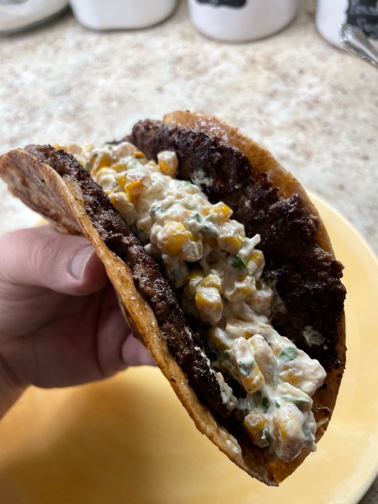 The completed, folded, street corn smash burger taco 
