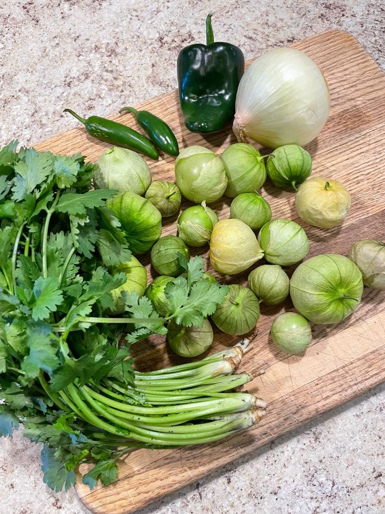 The produce listed above is all laid out on a cutting board. 