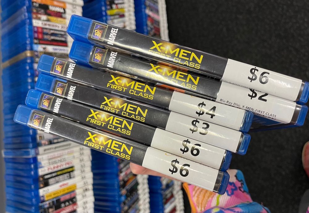 Me holding six copies of X-men First Class at cashies.