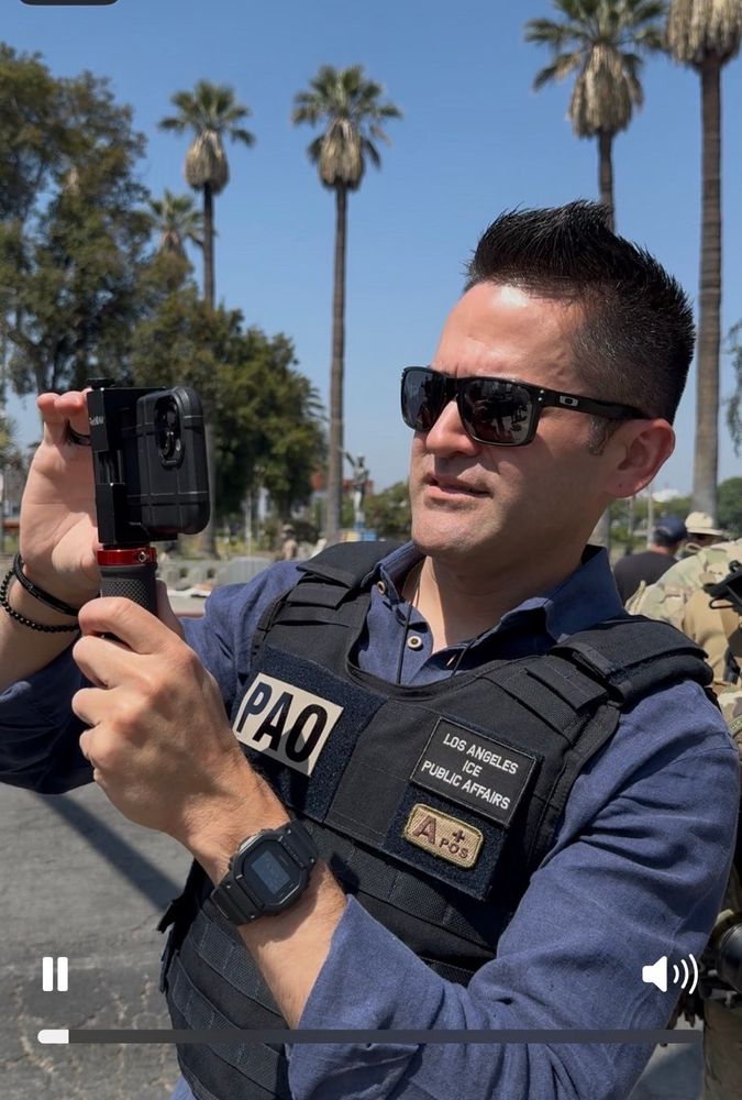 shoe polish hair sunglass man with tactical vest and public affairs ice patch with camera