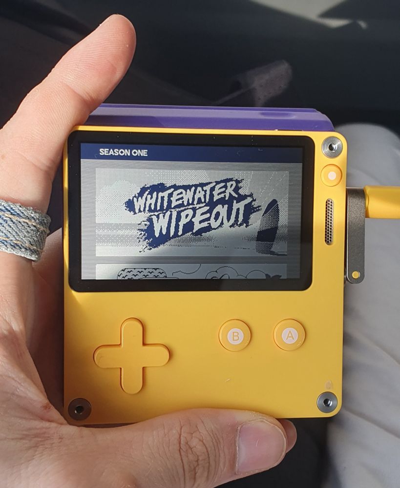 Me holding the playdate game console