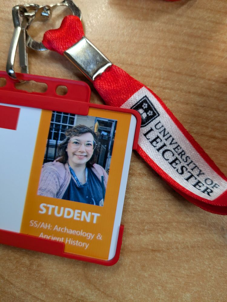 Photo of Kyra's student id and lanyard showing that they are in the school of archaeology and ancient history 