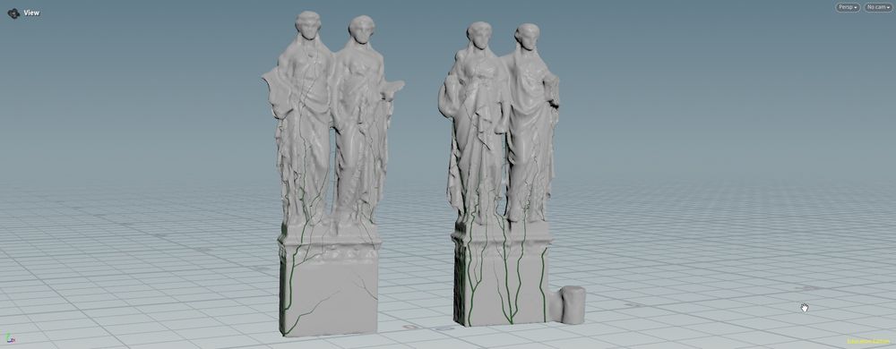 Vines growing on top of two statues
