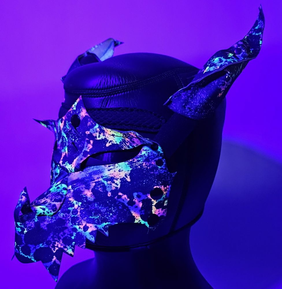 Our colorful UV reactive DRGN hood under a black light 