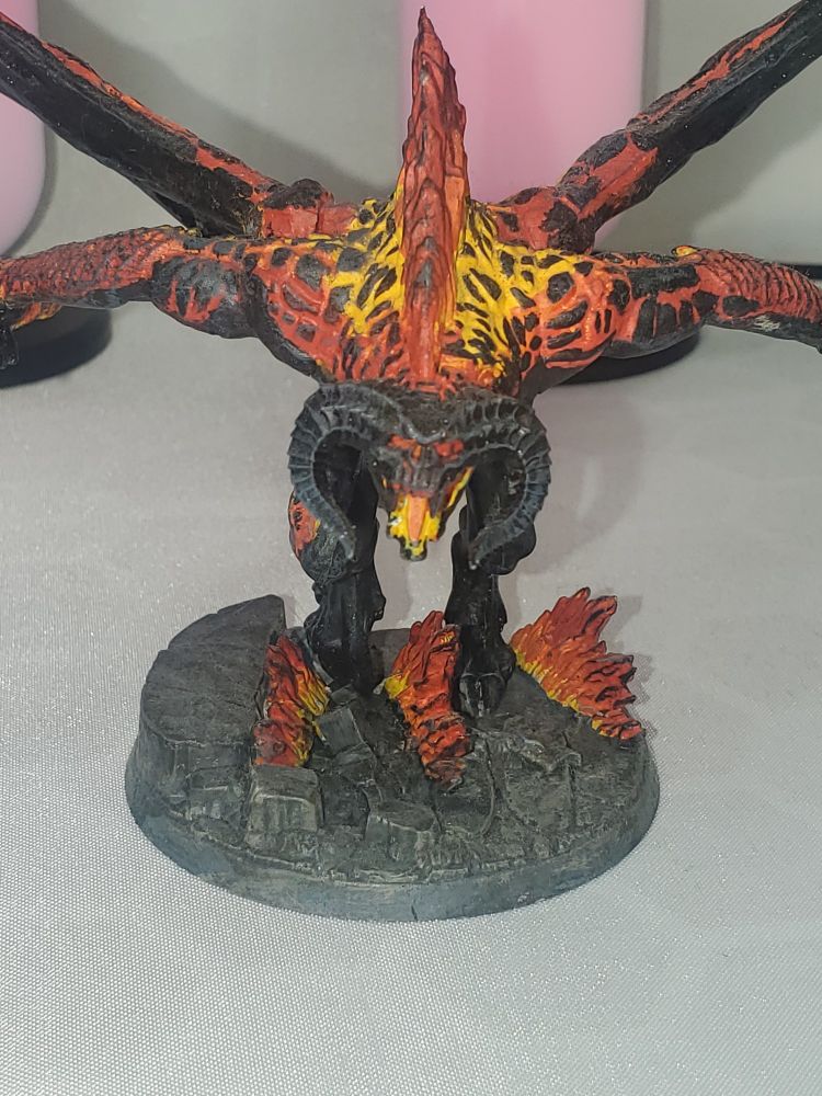 Close-up image of a Games Workshop Middle-Earth Balrog model, painted in a fiery scheme to match its film counterpart. 