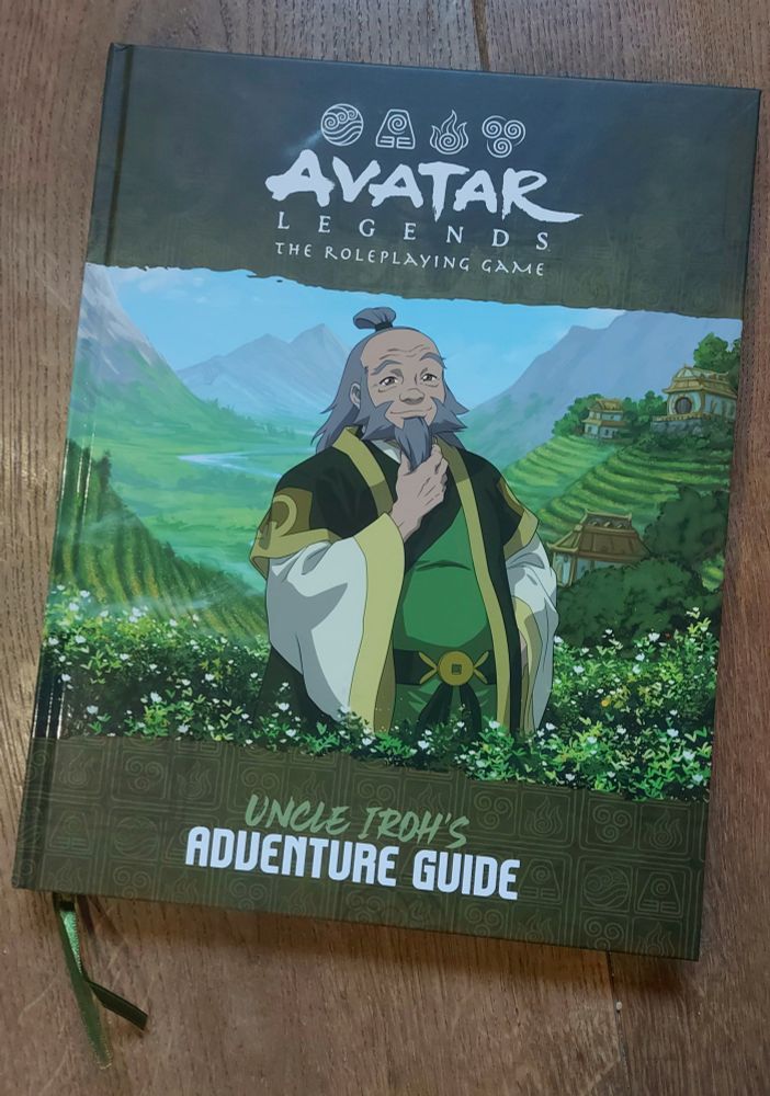 An Avatar Legends RPG sourcebook titled "Uncle Iroh's Adventure Guide." The green cover shows a happy Uncle Iroh in a field of tree leaves.