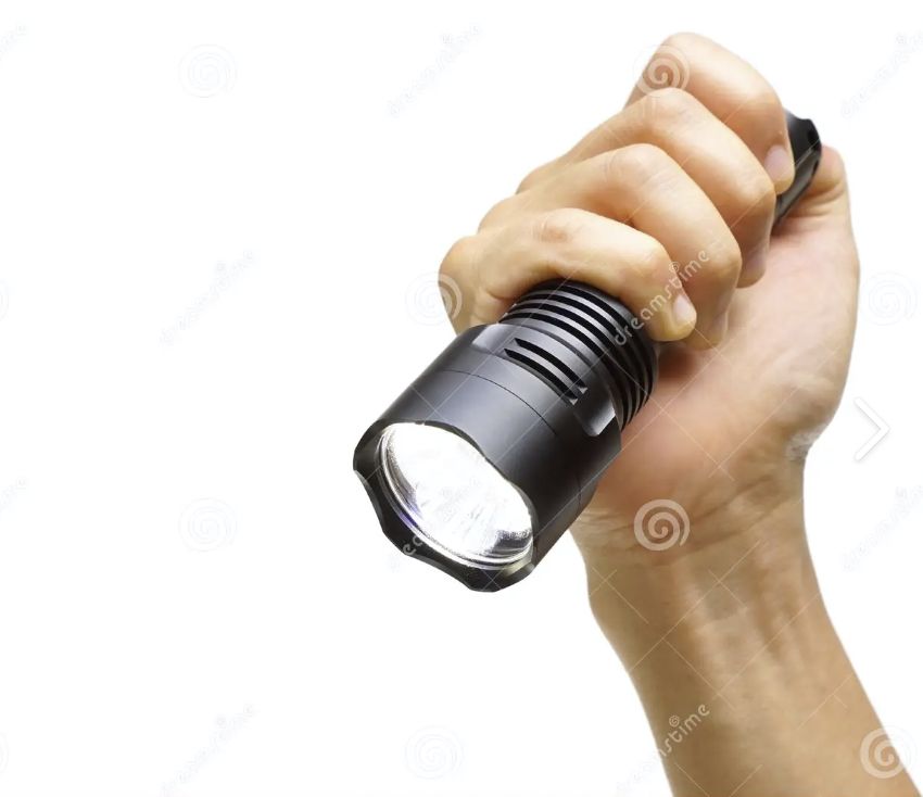 holding a flashlight upside down