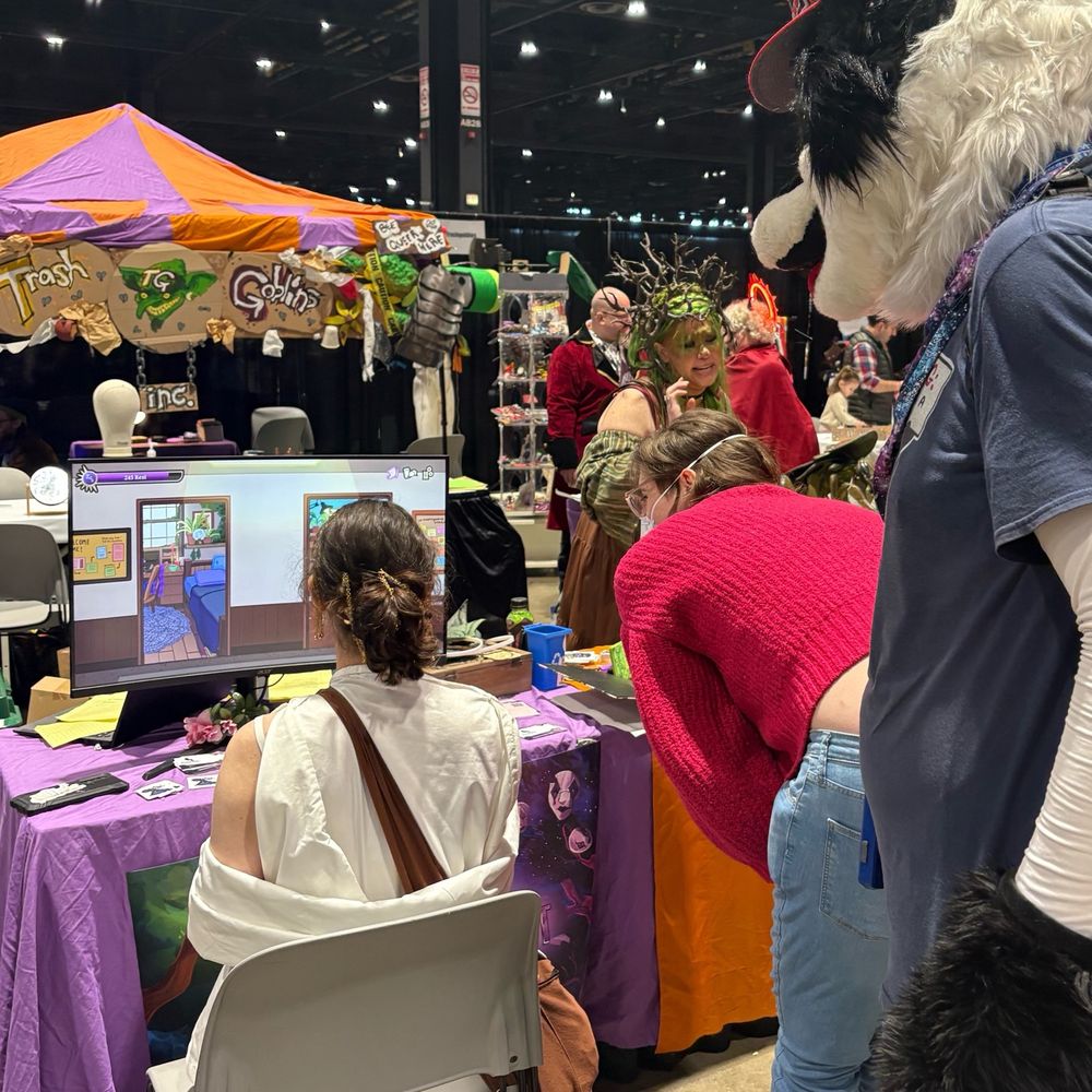 A person in a fursuit looks onto a person playing A Good Nights Rest