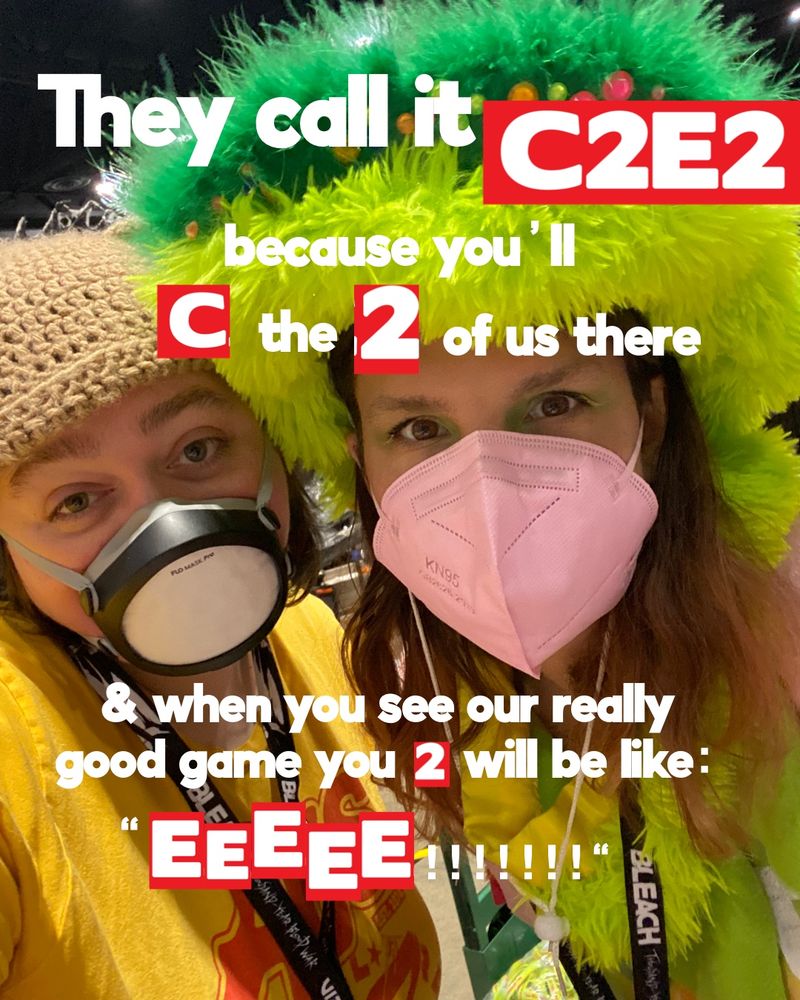 A picture of Nat & Lelia masked at a convention with the text "They call it C2E2 because you'll C the 2 of us there & when you see our really good game you 2 will be like: 'EEEEEE!!!!!'" The C, the 2's & the E's are all cut out from the C2E2 logo