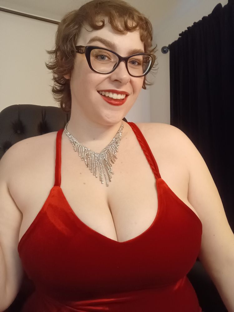 Jane in a sparkly necklace and red dress