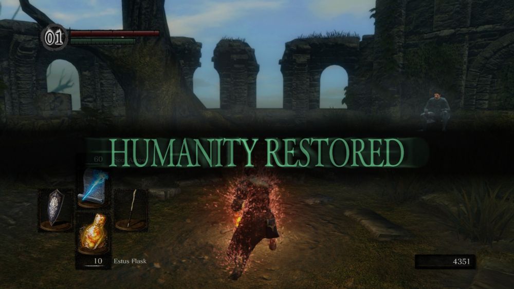 Captura de pantalla del videojuego Dark Souls con el texto Humanity Restored mostrado en el centro de la pantalla