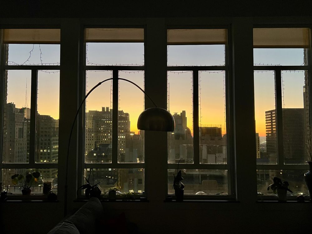 Sunrise through windows looking East toward NJ from Center City, Philadelphia