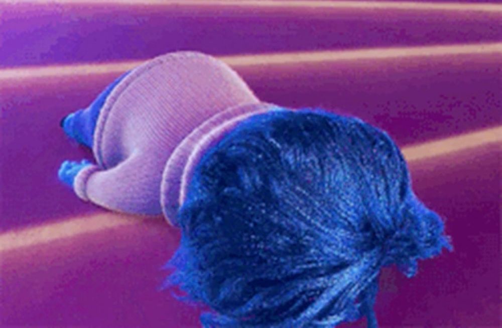 Sadness (from Disney & Pixar's 'Inside Out') flopped onto the ground.