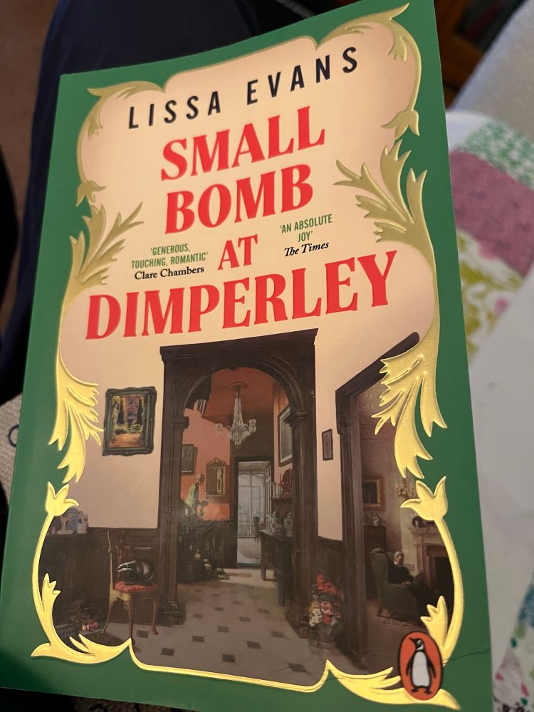Lissa Evans’ Small Bomb at Dimperley, illustrated with an image of the interior of a stately home 