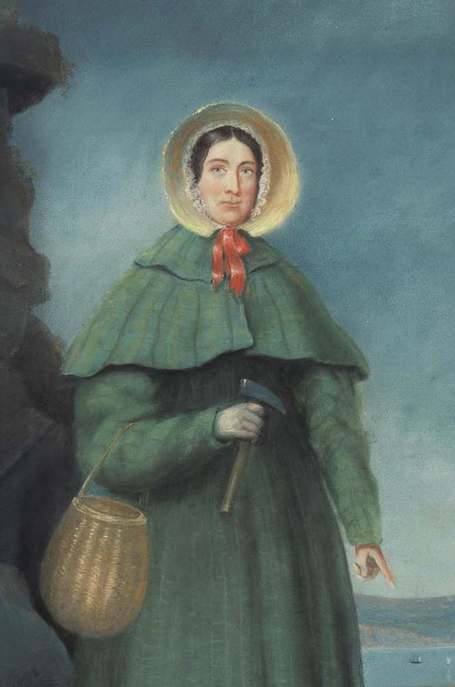 Portrait of Mary Anning in a green cloak and straw bonnet tied with a red ribbon, with a basket over her arm and a hammer in her hand. 