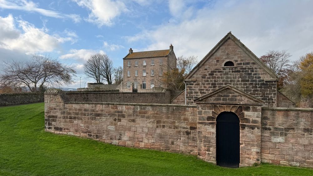 Garrison gunpowder magazine of 1749 on Berwick’s ramparts with 18th century Lion’s House beyond. 